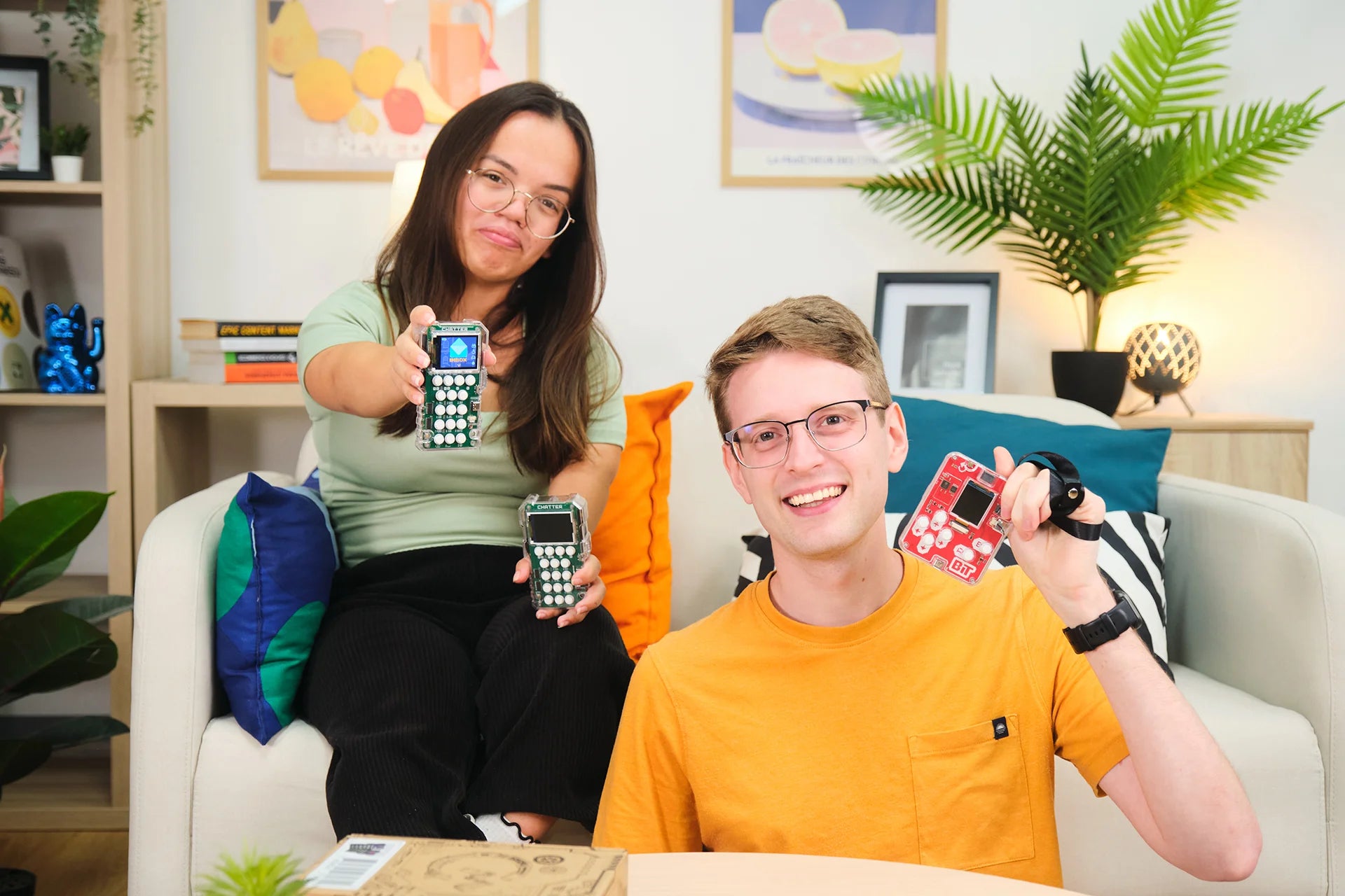 People playing with CircuitMess Chatter 2.0 and Bit 2.0