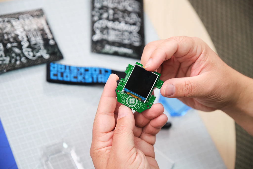 Man playing with CircuitMess Clockstar 2.0