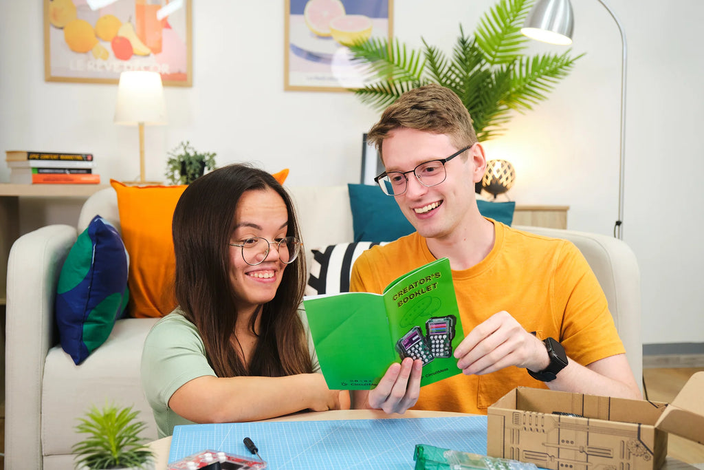 People playing with CircuitMess Chatter 2.0 and Bit 2.0