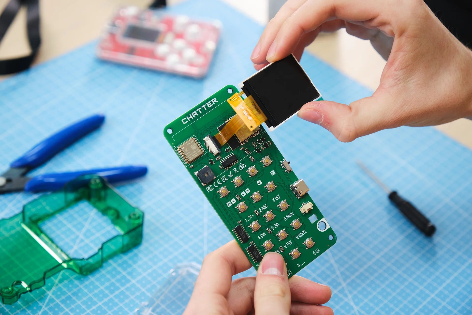 Man assembling CircuitMess Chatter 2.0