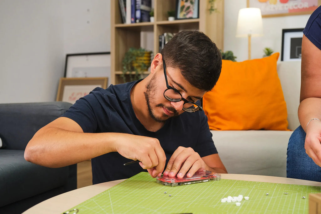 Man assembling CircuitMess ByteBoi