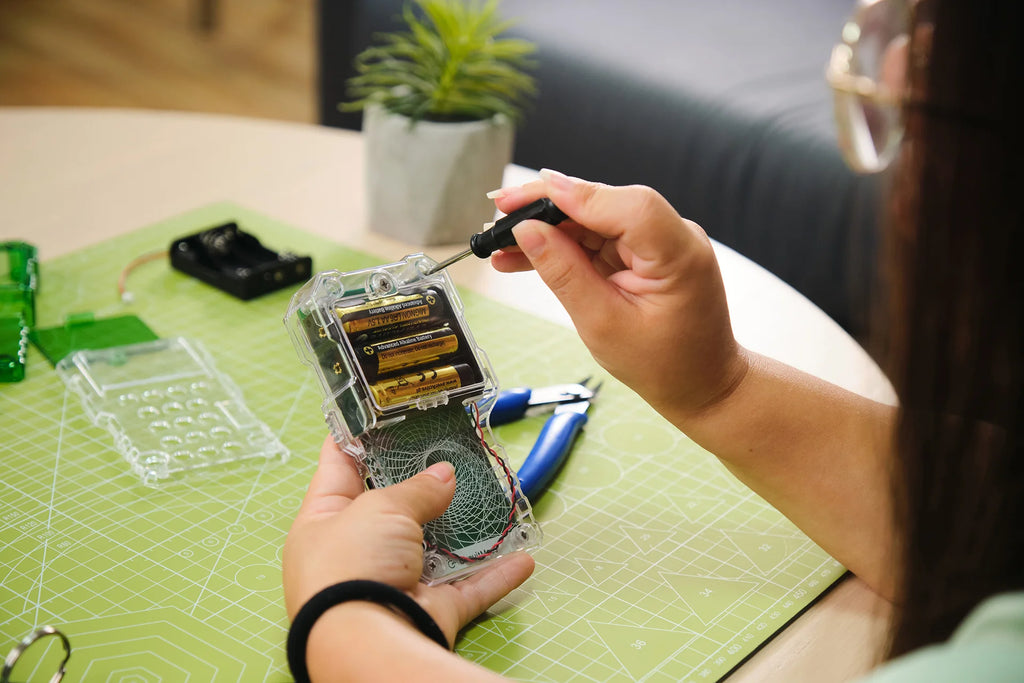 Woman playing with CircuitMess Chatter 2.0
