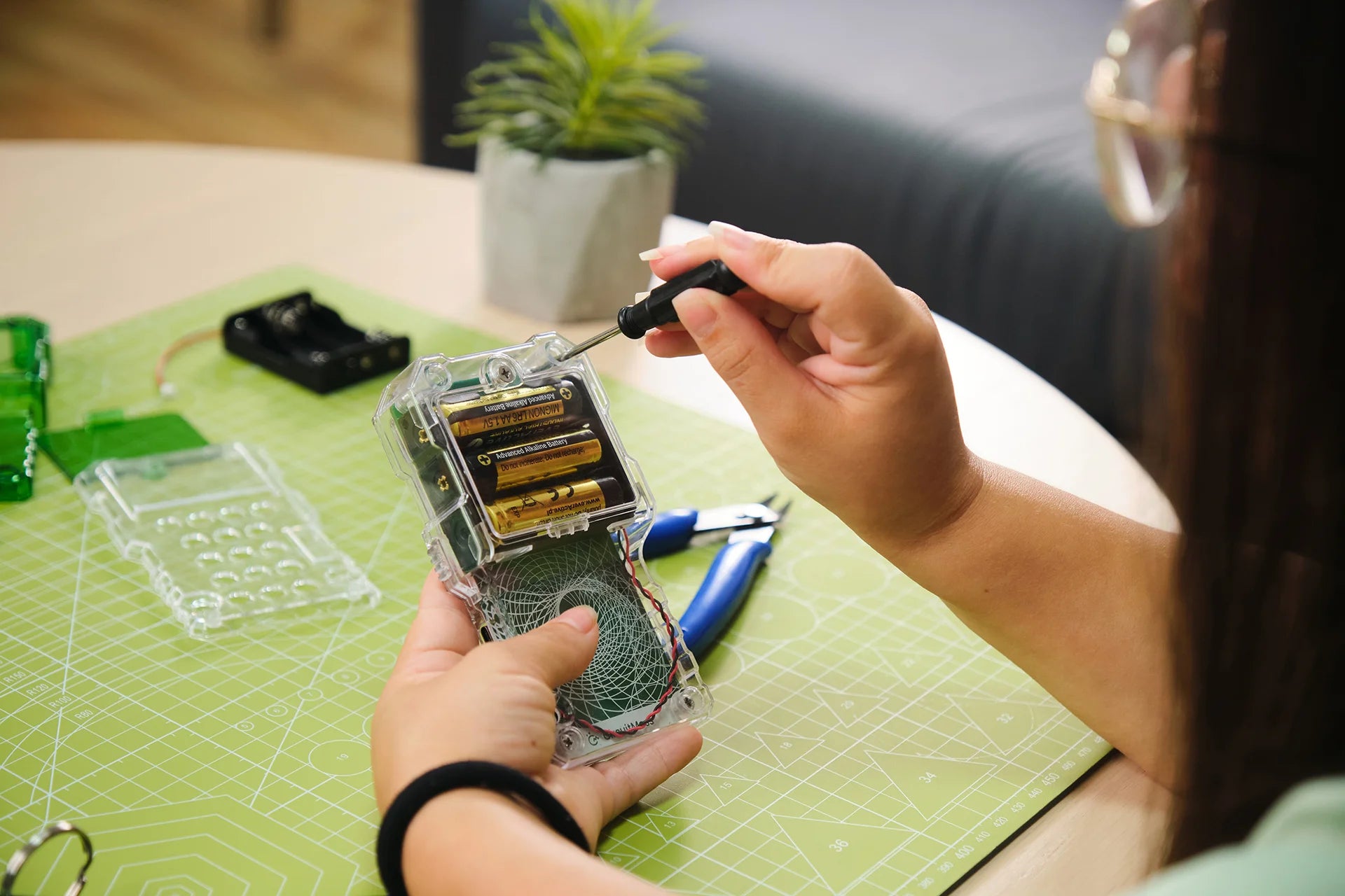 Woman playing with CircuitMess Chatter 2.0