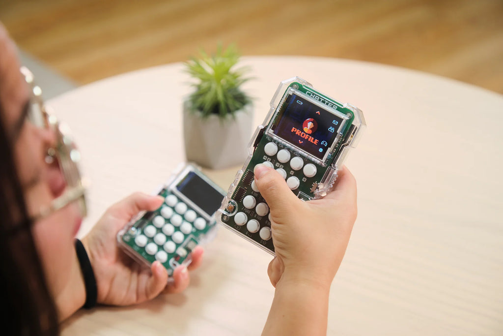 Woman playing with CircuitMess Chatter 2.0