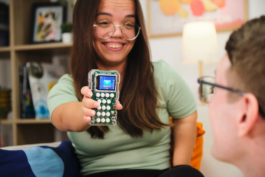 Woman playing with CircuitMess Chatter 2.0