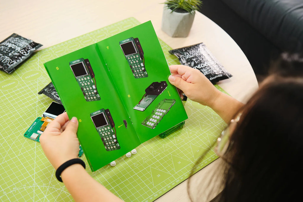 Woman playing with CircuitMess Chatter 2.0