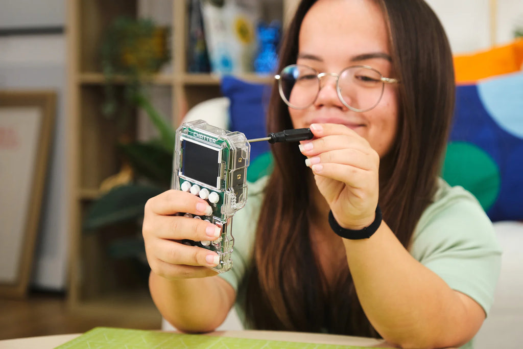 Woman playing with CircuitMess Chatter 2.0