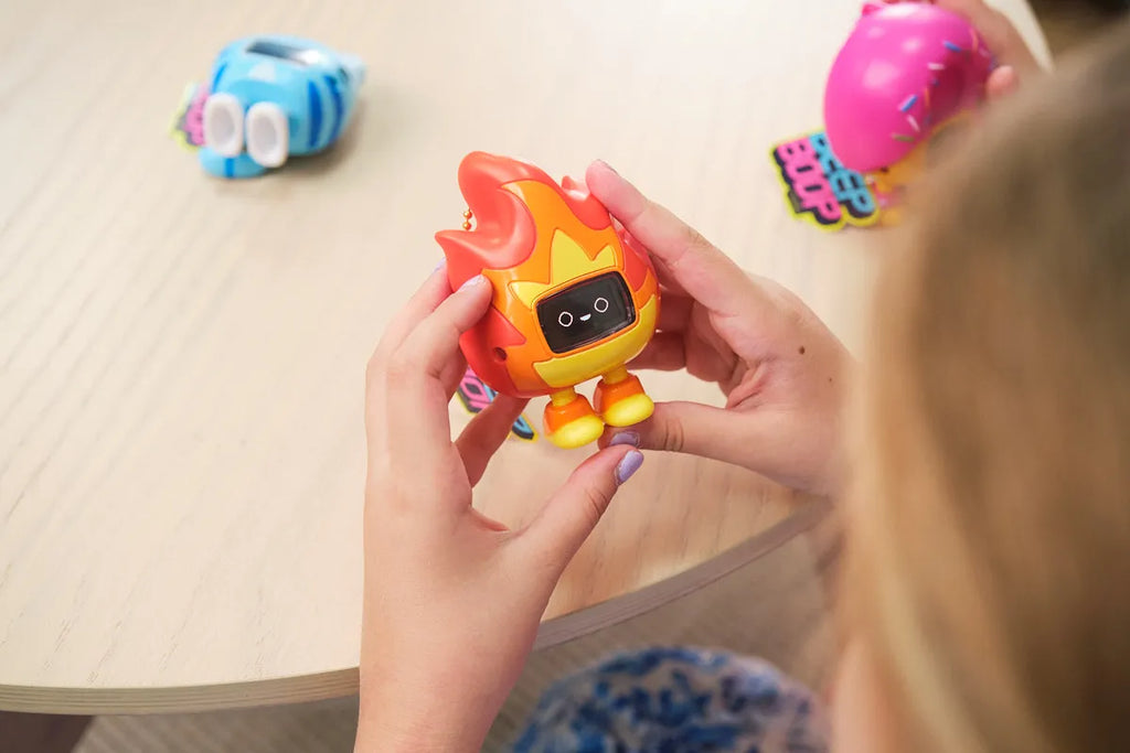Girls playing with CircuitMess Beep Boop Tochi