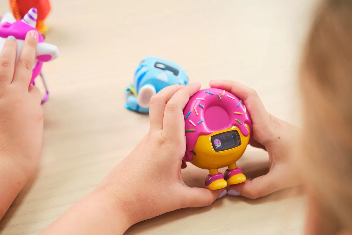 Girls playing with CircuitMess Beep Boop Mochi